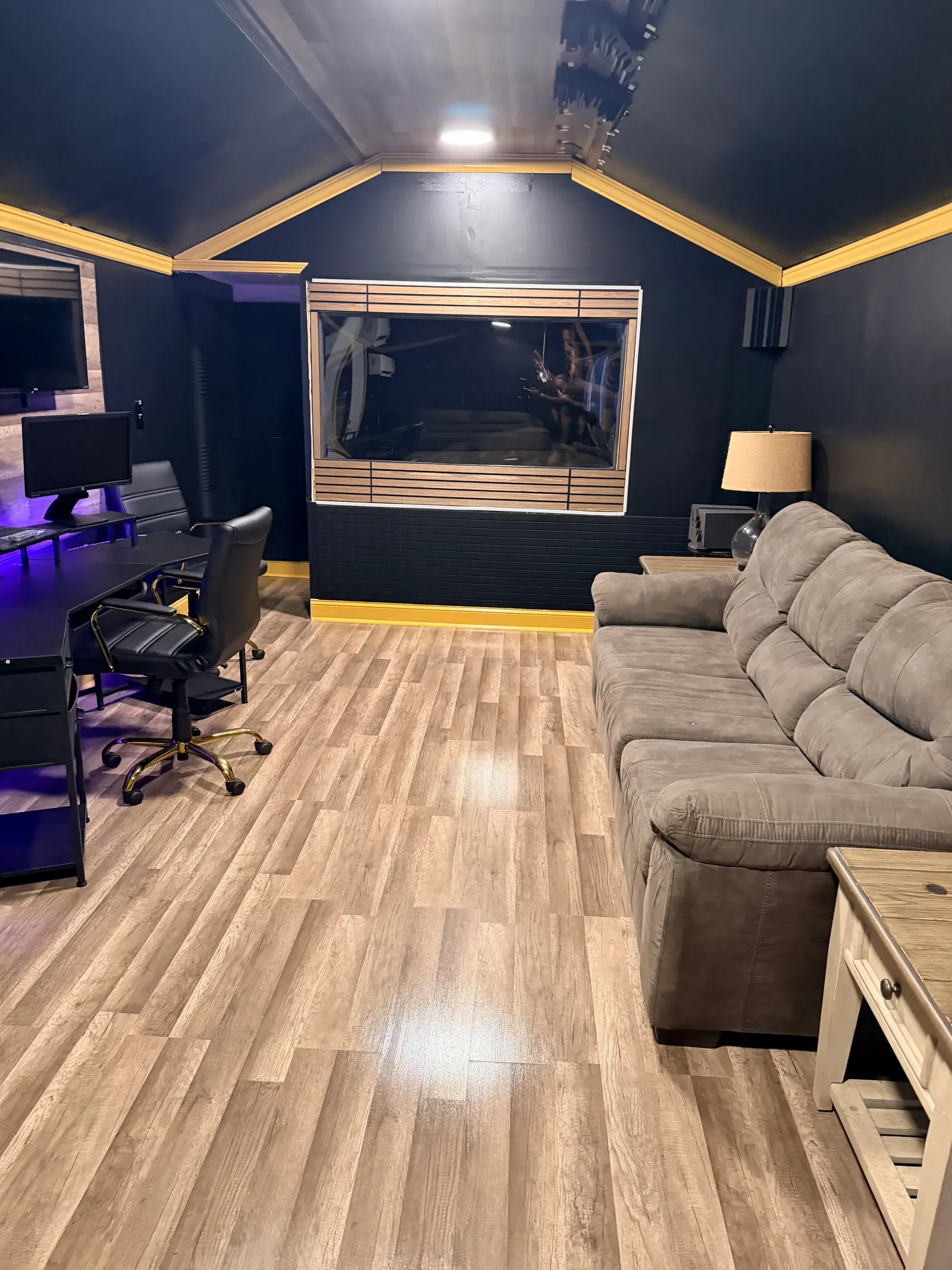 Game Time Studios control room with the window into the live booth and studio sofa